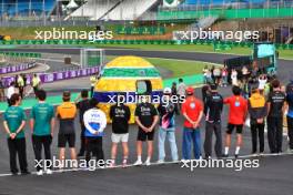 F1 drivers lined up at the Senna S with a tribute helmet of Ayrton Senna made from recycled materials. 31.10.2024. Formula 1 World Championship, Rd 21, Brazilian Grand Prix, Sao Paulo, Brazil, Preparation Day.