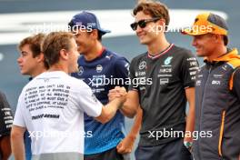 Sebastian Vettel (GER) with George Russell (GBR) Mercedes AMG F1 and Lando Norris (GBR) McLaren. 31.10.2024. Formula 1 World Championship, Rd 21, Brazilian Grand Prix, Sao Paulo, Brazil, Preparation Day.