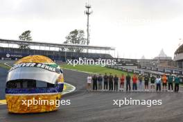 F1 drivers lined up at the Senna S with a tribute helmet of Ayrton Senna made from recycled materials. 31.10.2024. Formula 1 World Championship, Rd 21, Brazilian Grand Prix, Sao Paulo, Brazil, Preparation Day.