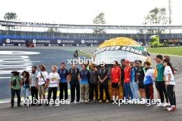 F1 drivers lined up at the Senna S with a tribute helmet of Ayrton Senna made from recycled materials. 31.10.2024. Formula 1 World Championship, Rd 21, Brazilian Grand Prix, Sao Paulo, Brazil, Preparation Day.