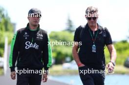 (L to R): Zhou Guanyu (CHN) Sauber with Graeme Lowdon (GBR). 07.06.2024. Formula 1 World Championship, Rd 9, Canadian Grand Prix, Montreal, Canada, Practice Day.