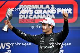 George Russell (GBR) Mercedes AMG F1 celebrates his third position on the podium. 09.06.2024. Formula 1 World Championship, Rd 9, Canadian Grand Prix, Montreal, Canada, Race Day.