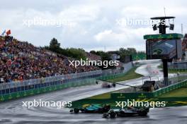 Fernando Alonso (ESP) Aston Martin F1 Team AMR24 leads Lewis Hamilton (GBR) Mercedes AMG F1 W15. 09.06.2024. Formula 1 World Championship, Rd 9, Canadian Grand Prix, Montreal, Canada, Race Day.