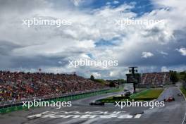Daniel Ricciardo (AUS) RB VCARB 01 leads Lance Stroll (CDN) Aston Martin F1 Team AMR24. 09.06.2024. Formula 1 World Championship, Rd 9, Canadian Grand Prix, Montreal, Canada, Race Day.