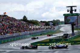 Nico Hulkenberg (GER) Haas VF-24 leads Daniel Ricciardo (AUS) RB VCARB 01. 09.06.2024. Formula 1 World Championship, Rd 9, Canadian Grand Prix, Montreal, Canada, Race Day.