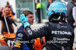 George Russell (GBR) Mercedes AMG F1 (Right) celebrates his pole position in qualifying parc ferme with second placed Max Verstappen (NLD) Red Bull Racing. 08.06.2024. Formula 1 World Championship, Rd 9, Canadian Grand Prix, Montreal, Canada, Qualifying Day.