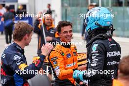 George Russell (GBR) Mercedes AMG F1 (Right) celebrates his pole position in qualifying parc ferme with third placed Lando Norris (GBR) McLaren (Centre) and second placed Max Verstappen (NLD) Red Bull Racing. 08.06.2024. Formula 1 World Championship, Rd 9, Canadian Grand Prix, Montreal, Canada, Qualifying Day.