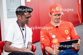 Charles Leclerc (MON) Ferrari with Lawrence Barretto (GBR) Formula 1 Senior Writer Editor. 06.06.2024. Formula 1 World Championship, Rd 9, Canadian Grand Prix, Montreal, Canada, Preparation Day.