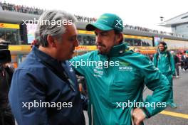 (L to R): Luca de Meo (ITA) Groupe Renault Chief Executive Officer with Fernando Alonso (ESP) Aston Martin F1 Team on the grid. 21.04.2024. Formula 1 World Championship, Rd 5, Chinese Grand Prix, Shanghai, China, Race Day.