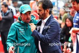 (L to R): Fernando Alonso (ESP) Aston Martin F1 Team with Mohammed Bin Sulayem (UAE) FIA President on the grid. 21.04.2024. Formula 1 World Championship, Rd 5, Chinese Grand Prix, Shanghai, China, Race Day.