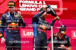 (L to R): Race winner Max Verstappen (NLD) Red Bull Racing celebrates on the podium with third placed Sergio Perez (MEX) Red Bull Racing and Paul Monaghan (GBR) Red Bull Racing Chief Engineer. 21.04.2024. Formula 1 World Championship, Rd 5, Chinese Grand Prix, Shanghai, China, Race Day.