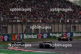 Nico Hulkenberg (GER) Haas VF-24 and Lewis Hamilton (GBR) Mercedes AMG F1 W15 battle for position. 21.04.2024. Formula 1 World Championship, Rd 5, Chinese Grand Prix, Shanghai, China, Race Day.