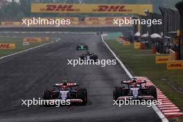Yuki Tsunoda (JPN) RB VCARB 01 and Daniel Ricciardo (AUS) RB VCARB 01 battle for position. 21.04.2024. Formula 1 World Championship, Rd 5, Chinese Grand Prix, Shanghai, China, Race Day.