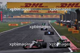 Nico Hulkenberg (GER) Haas VF-24 and Lewis Hamilton (GBR) Mercedes AMG F1 W15 battle for position. 21.04.2024. Formula 1 World Championship, Rd 5, Chinese Grand Prix, Shanghai, China, Race Day.