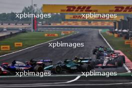 Daniel Ricciardo (AUS) RB VCARB 01 and Lance Stroll (CDN) Aston Martin F1 Team AMR24 collide. 21.04.2024. Formula 1 World Championship, Rd 5, Chinese Grand Prix, Shanghai, China, Race Day.