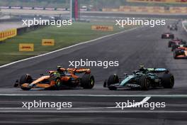Lando Norris (GBR) McLaren MCL38 and Fernando Alonso (ESP) Aston Martin F1 Team AMR24 battle for position. 21.04.2024. Formula 1 World Championship, Rd 5, Chinese Grand Prix, Shanghai, China, Race Day.
