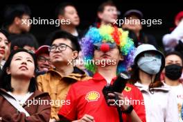 Circuit atmosphere - Ferrari fan in the grandstand. 20.04.2024. Formula 1 World Championship, Rd 5, Chinese Grand Prix, Shanghai, China, Sprint and Qualifying Day.