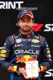 Sergio Perez (MEX) Red Bull Racing celebrates his third position in Sprint parc ferme. 20.04.2024. Formula 1 World Championship, Rd 5, Chinese Grand Prix, Shanghai, China, Sprint and Qualifying Day.