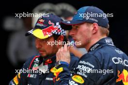 Sprint winner Max Verstappen (NLD) Red Bull Racing (Right) with team mate Sergio Perez (MEX) Red Bull Racing in parc ferme. 20.04.2024. Formula 1 World Championship, Rd 5, Chinese Grand Prix, Shanghai, China, Sprint and Qualifying Day.