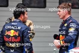 (L to R): Sergio Perez (MEX) Red Bull Racing with Sprint winner Max Verstappen (NLD) Red Bull Racing in parc ferme. 20.04.2024. Formula 1 World Championship, Rd 5, Chinese Grand Prix, Shanghai, China, Sprint and Qualifying Day.