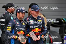 (L to R): third placed Sergio Perez (MEX) Red Bull Racing with Sprint winner Max Verstappen (NLD) Red Bull Racing in parc ferme. 20.04.2024. Formula 1 World Championship, Rd 5, Chinese Grand Prix, Shanghai, China, Sprint and Qualifying Day.