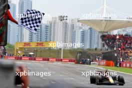 Race winner Max Verstappen (NLD) Red Bull Racing RB20 takes the chequered flag at the end of Sprint. 20.04.2024. Formula 1 World Championship, Rd 5, Chinese Grand Prix, Shanghai, China, Sprint and Qualifying Day.