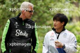 (L to R): Alessandro Alunni Bravi (ITA) Sauber Managing Director and Team Representative with Yuki Tsunoda (JPN) RB. 21.04.2024. Formula 1 World Championship, Rd 5, Chinese Grand Prix, Shanghai, China, Race Day.