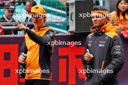 (L to R): Oscar Piastri (AUS) McLaren and Lando Norris (GBR) McLaren on the drivers' parade. 21.04.2024. Formula 1 World Championship, Rd 5, Chinese Grand Prix, Shanghai, China, Race Day.