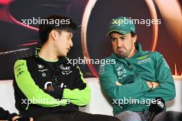 (L to R): Zhou Guanyu (CHN) Sauber and Fernando Alonso (ESP) Aston Martin F1 Team in the FIA Press Conference. 18.04.2024. Formula 1 World Championship, Rd 5, Chinese Grand Prix, Shanghai, China, Preparation Day.