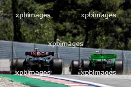 Lewis Hamilton (GBR) Mercedes AMG F1 W15 and Zhou Guanyu (CHN) Sauber C44. 21.06.2024 Formula 1 World Championship, Rd 10, Spanish Grand Prix, Barcelona, Spain, Practice Day.