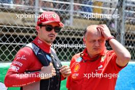 (L to R): Charles Leclerc (MON) Ferrari with Frederic Vasseur (FRA) Ferrari Team Principal on the grid. 23.06.2024. Formula 1 World Championship, Rd 10, Spanish Grand Prix, Barcelona, Spain, Race Day.