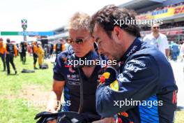 Sergio Perez (MEX) Red Bull Racing with Xavi Martos (ESP) Red Bull Racing F1 Team Physio on the grid. 23.06.2024. Formula 1 World Championship, Rd 10, Spanish Grand Prix, Barcelona, Spain, Race Day.