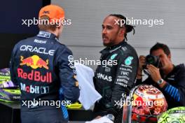 (L to R): Race winner Max Verstappen (NLD) Red Bull Racing with Lewis Hamilton (GBR) Mercedes AMG F1 in parc ferme. 23.06.2024. Formula 1 World Championship, Rd 10, Spanish Grand Prix, Barcelona, Spain, Race Day.