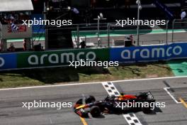 Race winner Max Verstappen (NLD) Red Bull Racing RB20 takes the chequered flag at the end of the race. 23.06.2024. Formula 1 World Championship, Rd 10, Spanish Grand Prix, Barcelona, Spain, Race Day.