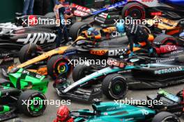 George Russell (GBR) Mercedes AMG F1 W15 and Oscar Piastri (AUS) McLaren MCL38 in parc ferme. 23.06.2024. Formula 1 World Championship, Rd 10, Spanish Grand Prix, Barcelona, Spain, Race Day.