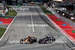 Oscar Piastri (AUS) McLaren MCL38 and Pierre Gasly (FRA) Alpine F1 Team A524 battle for position. 23.06.2024. Formula 1 World Championship, Rd 10, Spanish Grand Prix, Barcelona, Spain, Race Day.
