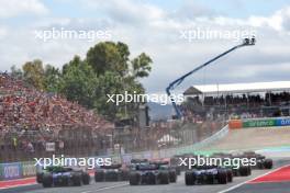 Daniel Ricciardo (AUS) RB VCARB 01; Logan Sargeant (USA) Williams Racing FW46; and Yuki Tsunoda (JPN) RB VCARB 01 at the start of the race. 23.06.2024. Formula 1 World Championship, Rd 10, Spanish Grand Prix, Barcelona, Spain, Race Day.