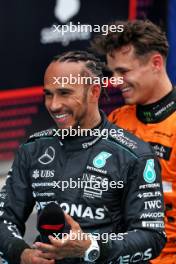 Lewis Hamilton (GBR) Mercedes AMG F1 and Lando Norris (GBR) McLaren in qualifying parc ferme. 22.06.2024. Formula 1 World Championship, Rd 10, Spanish Grand Prix, Barcelona, Spain, Qualifying Day.