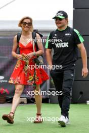 (L to R): Tiffany Cromwell (AUS) Professional Cyclist with her boyfriend Valtteri Bottas (FIN) Sauber. 23.06.2024. Formula 1 World Championship, Rd 10, Spanish Grand Prix, Barcelona, Spain, Race Day.