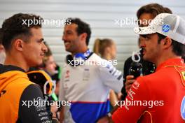 (L to R): Lando Norris (GBR) McLaren and Carlos Sainz Jr (ESP) Ferrari on the drivers' parade. 23.06.2024. Formula 1 World Championship, Rd 10, Spanish Grand Prix, Barcelona, Spain, Race Day.
