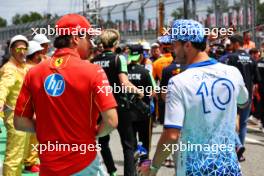 (L to R): Charles Leclerc (MON) Ferrari and Pierre Gasly (FRA) Alpine F1 Team on the drivers' parade. 23.06.2024. Formula 1 World Championship, Rd 10, Spanish Grand Prix, Barcelona, Spain, Race Day.