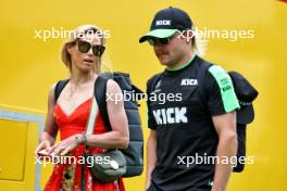 (L to R): Tiffany Cromwell (AUS) Professional Cyclist with her boyfriend Valtteri Bottas (FIN) Sauber. 23.06.2024. Formula 1 World Championship, Rd 10, Spanish Grand Prix, Barcelona, Spain, Race Day.