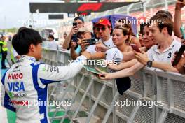 Yuki Tsunoda (JPN) RB with fans in the pits. 20.06.2024. Formula 1 World Championship, Rd 10, Spanish Grand Prix, Barcelona, Spain, Preparation Day.