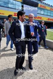 (L to R): Mohammed Bin Sulayem (UAE) FIA President with Stefano Domenicali (ITA) Formula One President and CEO on the grid. 07.07.2024. Formula 1 World Championship, Rd 12, British Grand Prix, Silverstone, England, Race Day.