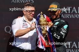 (L to R): Peter Bonnington (GBR) Mercedes AMG F1 Race Engineer celebrates on the podium with race winner Lewis Hamilton (GBR) Mercedes AMG F1. 07.07.2024. Formula 1 World Championship, Rd 12, British Grand Prix, Silverstone, England, Race Day.