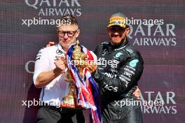 (L to R): Peter Bonnington (GBR) Mercedes AMG F1 Race Engineer celebrates on the podium with race winner Lewis Hamilton (GBR) Mercedes AMG F1. 07.07.2024. Formula 1 World Championship, Rd 12, British Grand Prix, Silverstone, England, Race Day.