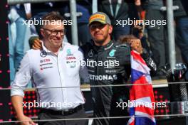 (L to R): Peter Bonnington (GBR) Mercedes AMG F1 Race Engineer celebrates on the podium with race winner Lewis Hamilton (GBR) Mercedes AMG F1. 07.07.2024. Formula 1 World Championship, Rd 12, British Grand Prix, Silverstone, England, Race Day.