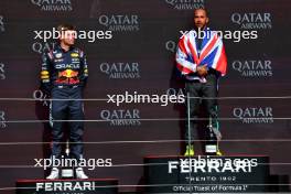 (L to R): Max Verstappen (NLD) Red Bull Racing celebrates his second position on the podium with race winner Lewis Hamilton (GBR) Mercedes AMG F1. 07.07.2024. Formula 1 World Championship, Rd 12, British Grand Prix, Silverstone, England, Race Day.