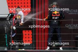 Max Verstappen (NLD) Red Bull Racing, second; Peter Bonnington (GBR) Mercedes AMG F1 Race Engineer; Lewis Hamilton (GBR) Mercedes AMG F1, race winner; Lando Norris (GBR) McLaren, third. 07.07.2024. Formula 1 World Championship, Rd 12, British Grand Prix, Silverstone, England, Race Day.