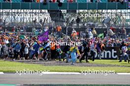 Circuit atmosphere - fans invade the circuit after the end of the race. 07.07.2024. Formula 1 World Championship, Rd 12, British Grand Prix, Silverstone, England, Race Day.